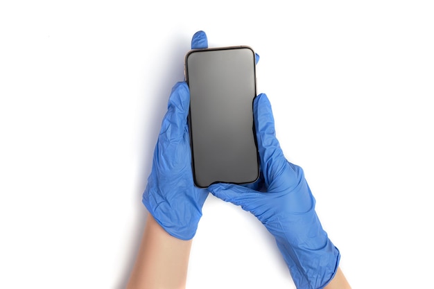 Doctor in blue glove is holding touchscreen smartphone in his hands Isolated on white background