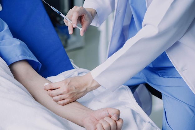 Doctor check up after surgery doctor touching patient hand and consoling