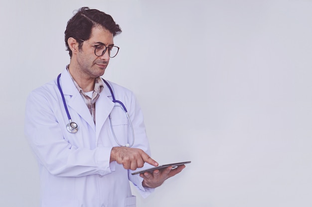 Doctor checking patient information on a tablet device