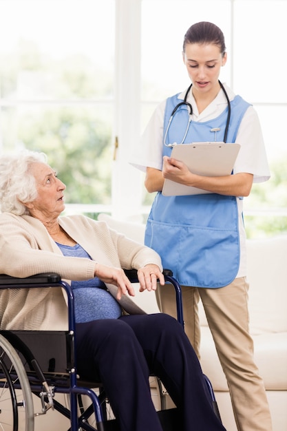 Doctor checking patients health at home