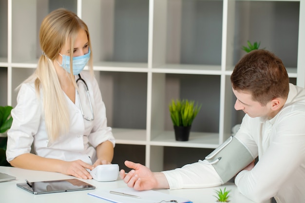 Doctor checks the health of the patient in the clinic