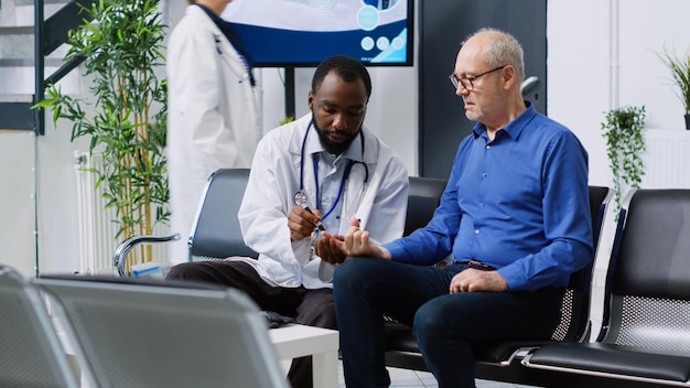 A doctor checks a patient's pulse.