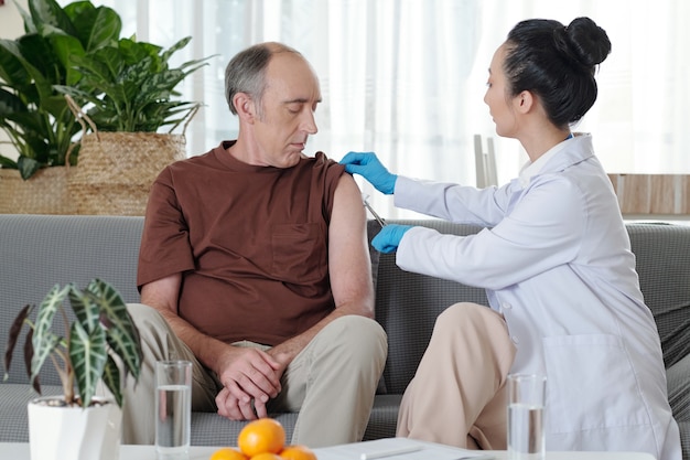 Doctor Cleaning Vaccine Site