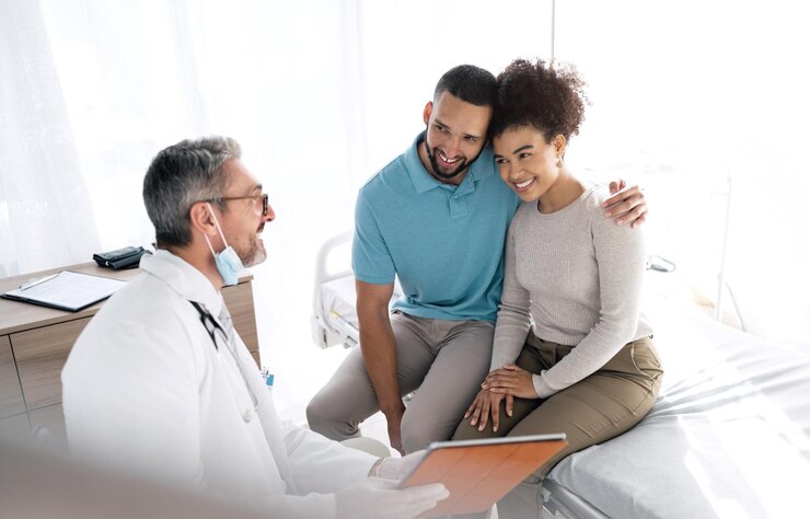 Photo doctor clipboard couple and smile for results gynecology news or medical clinic info success or wellness gynecologist report paperwork or marriage people happy for feedback notes or health data