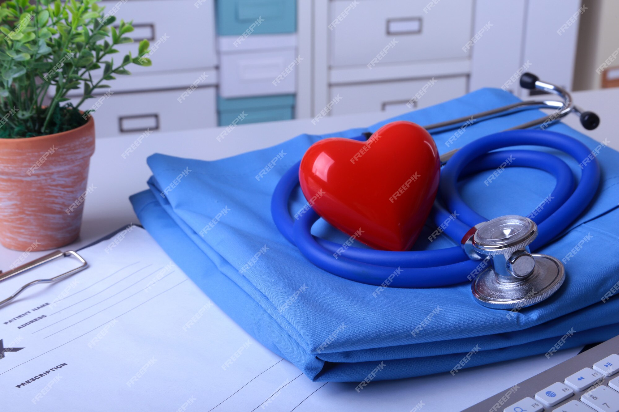 Premium Photo  Doctor coat with medical stethoscope and red heart on the  desk