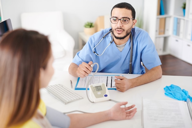 Doctor Consulting Patient in Modern Clinic