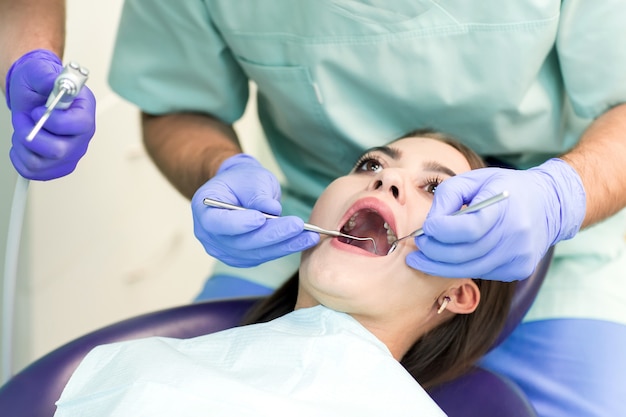 Doctor Dentist with an assistant work in a dental clinic.