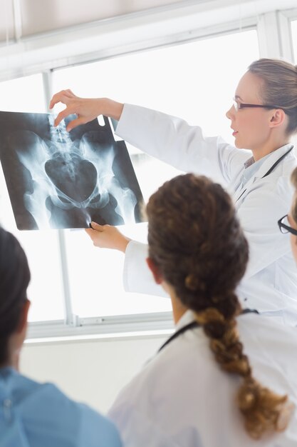 Doctor discussing medical Xray with colleagues