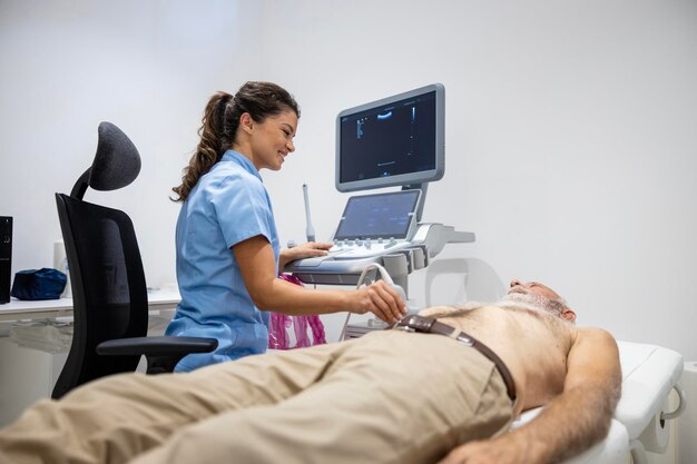 Doctor doing abdominal ultrasound of patient internal organs like liver pancreas gallbladder spleen