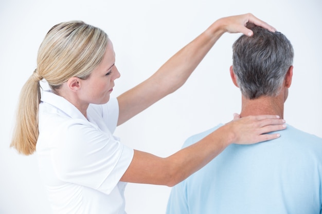 Doctor doing neck adjustment