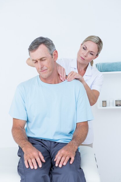 Doctor doing neck adjustment