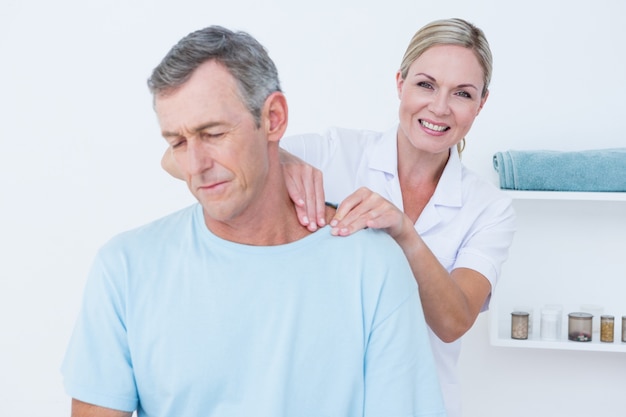 Doctor doing neck adjustment