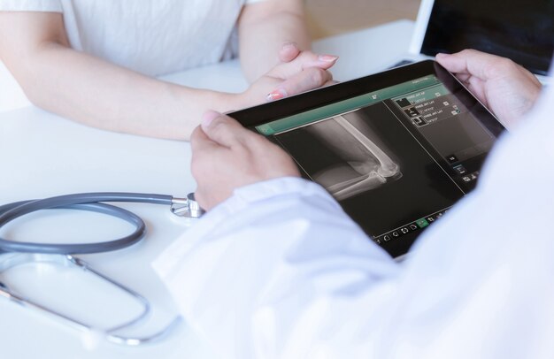 The doctor examines the bones and joints the patient