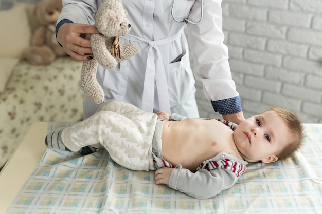 Doctor examining a baby in a hospital