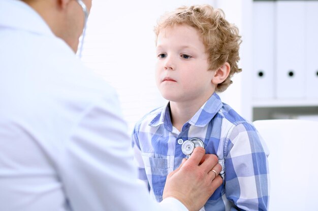 Doctor examining a child  patient by stethoscope