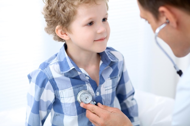 Doctor examining a child  patient by stethoscope.