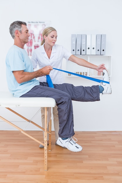 Doctor examining her patient back legs