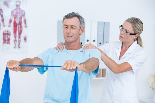 Doctor examining her patient back 