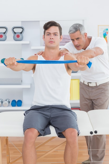 Doctor examining his patient back 