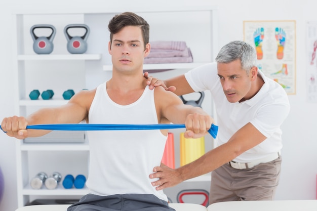 Doctor examining his patient back 