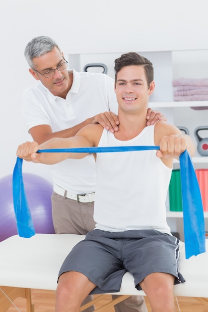 Doctor examining his patient back 