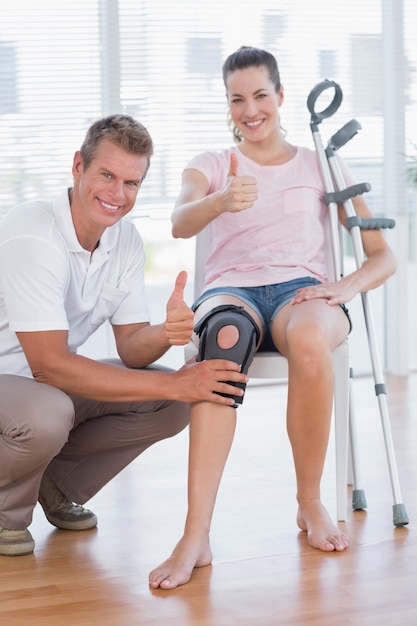 Doctor examining his patient knee