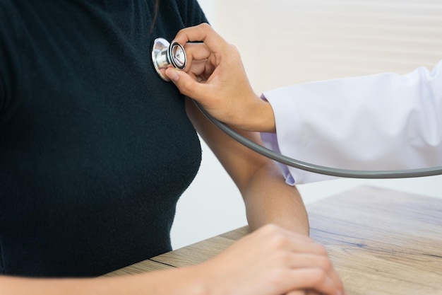 Doctor examining patient in hospital