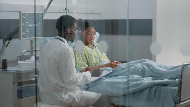 Doctor examining patient in hospital