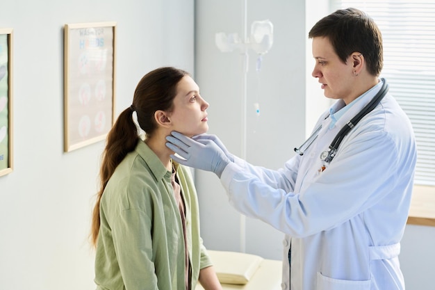 doctor examining patient in medical office setting