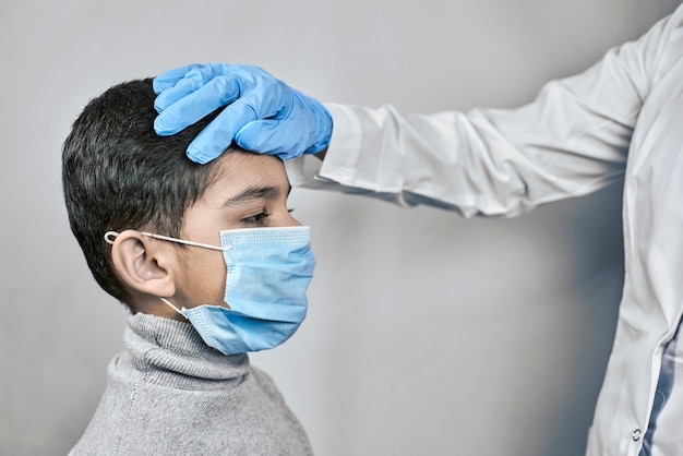 Doctor examining preschool kid