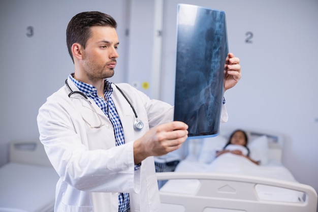 Doctor examining x-ray of patient