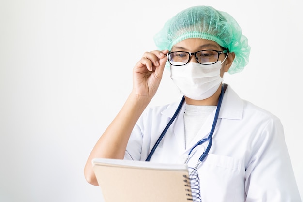 Doctor under face mask covering mouth and nose. 