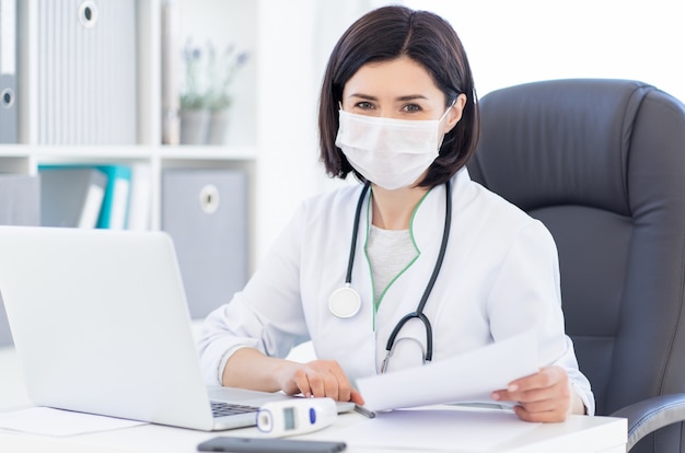 Doctor in face mask at work