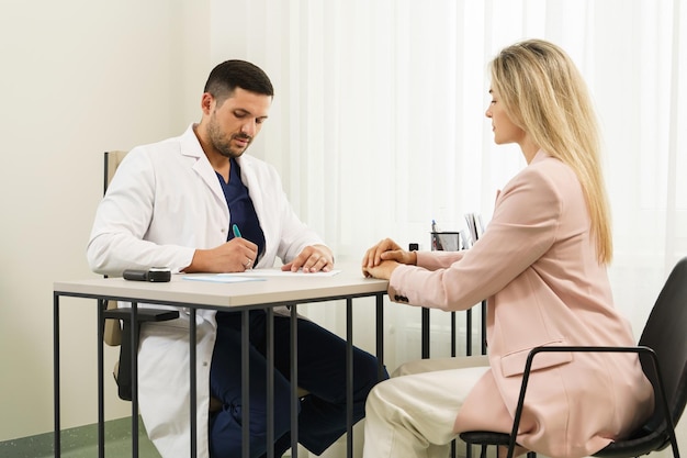 Doctor and female patient during consultation in office