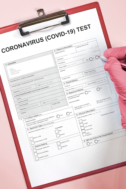 Doctor filling medical form for coronavirus test