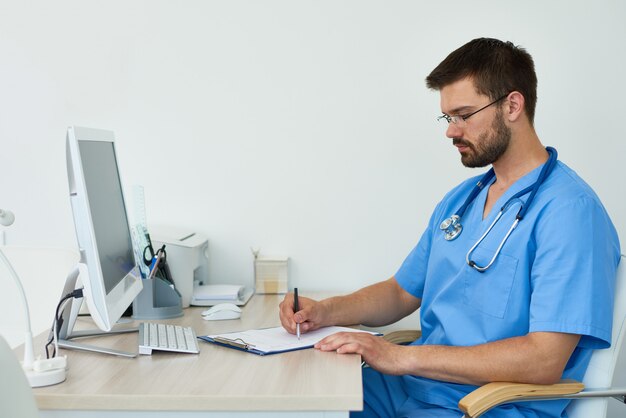 Doctor Filling Patients Records