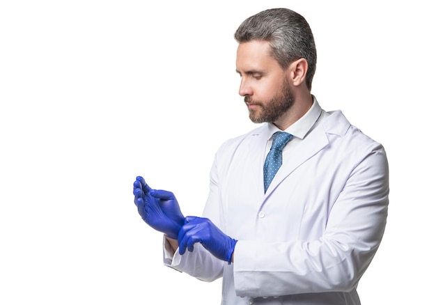 Doctor getting ready and wearing protecting gloves sterile protective gloves