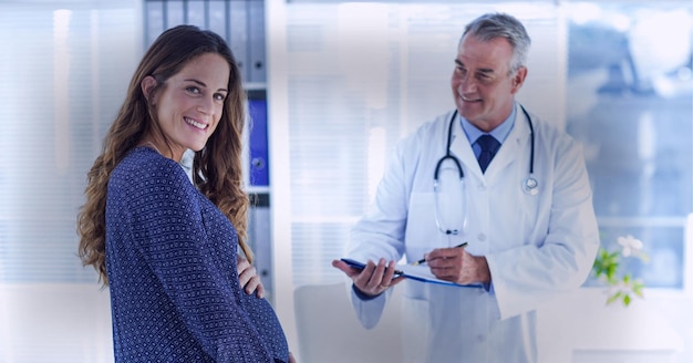 Doctor giving consultation to a pregnant patient, healthcare and medical professionals concepts