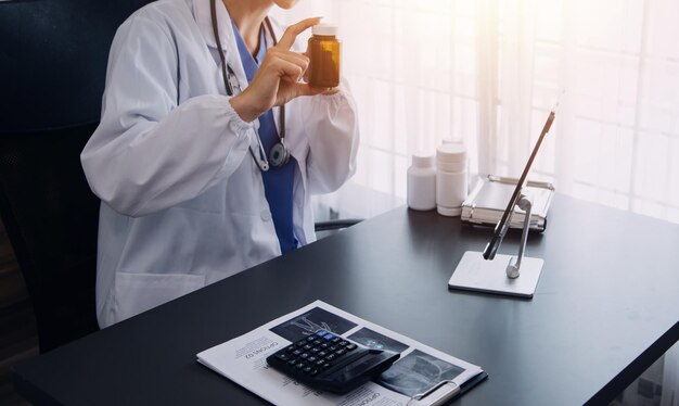 Doctor hand holding pen writing patient history list on clipboard about medication and treatment