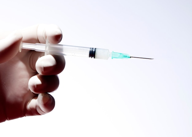 doctor hand with syringe for coronavirus vaccine injection.