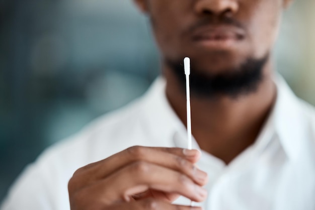 Doctor hands and covid test swab for appointment examination or results for healthcare at the hospital Hand of medical professional holding nasal pcr sample for testing corona virus or diagnosis