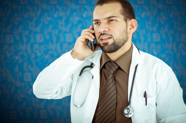 Photo doctor having a call from one of his patients