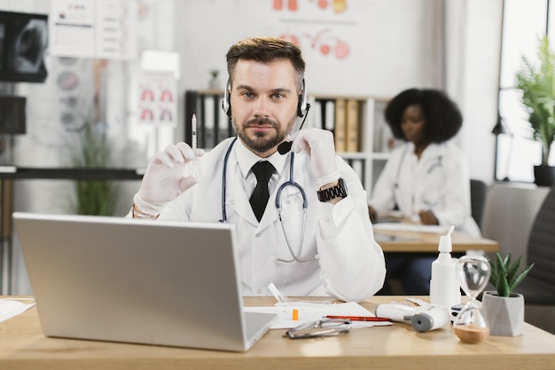 Doctor having online discuss with colleagues about vaccine