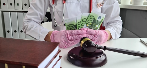 Doctor hold euro money and court gavel