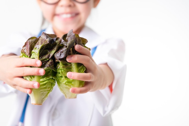 Doctor holding basket assort fresh vegetables isolated on white background.