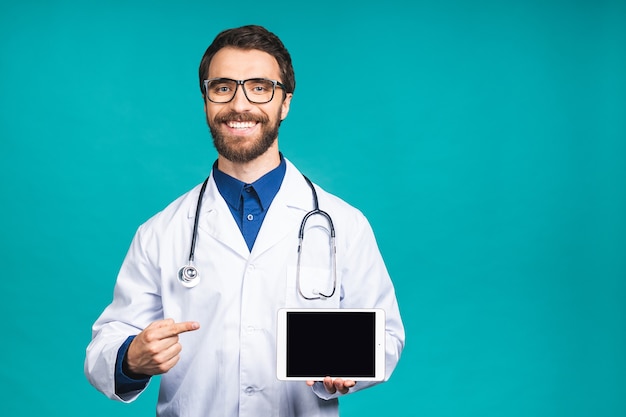 Doctor holding blank digital tablet isolated on blue background with clipping path for the screen.