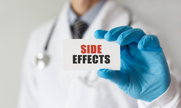 Doctor holding a card with text Side Effects