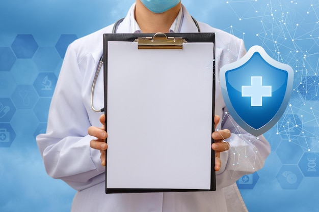 A doctor holding a clipboard with a blue shield in the background.