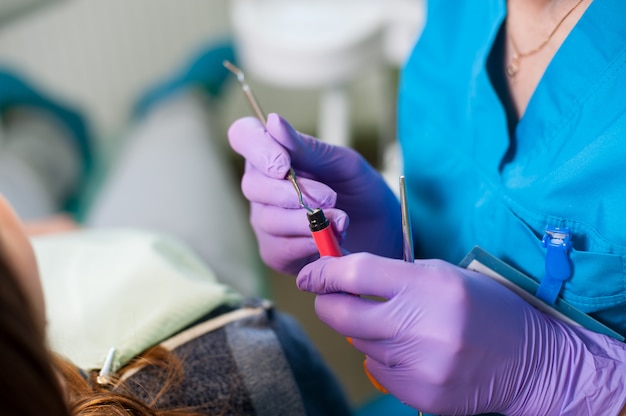 Photo doctor holding a composite cements for the treatment