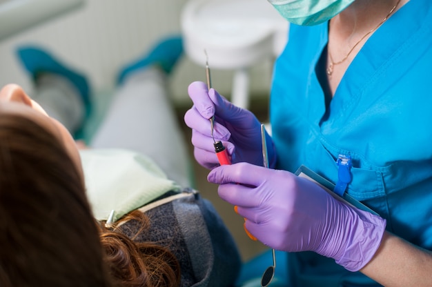 Doctor holding a composite cements for the treatment